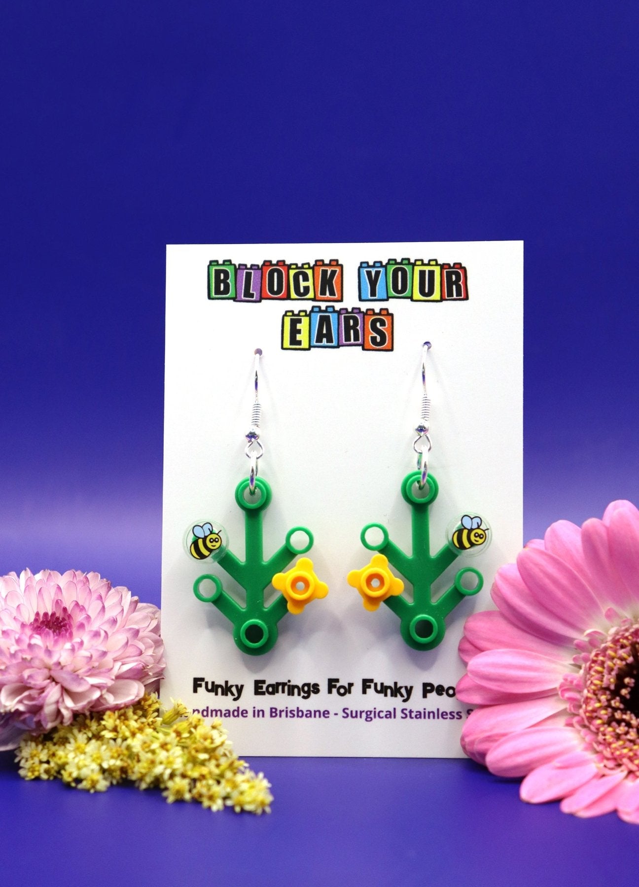 LEGO plant earrings with yellow flower and bee-Cute dangles on display card-Blue background with large flowers at side