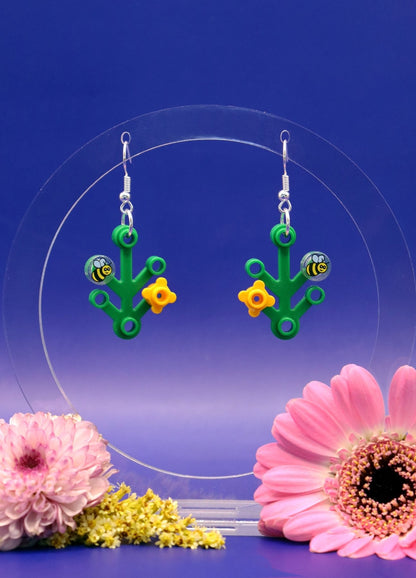 Quirky LEGO plant earrings with yellow flower and bee-Cute dangles on hanger-Blue background
