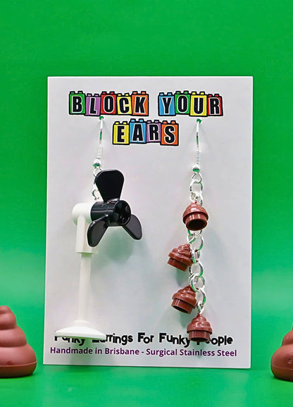 black-brown-fan-poo-lego-mismatched-earrings-green-background