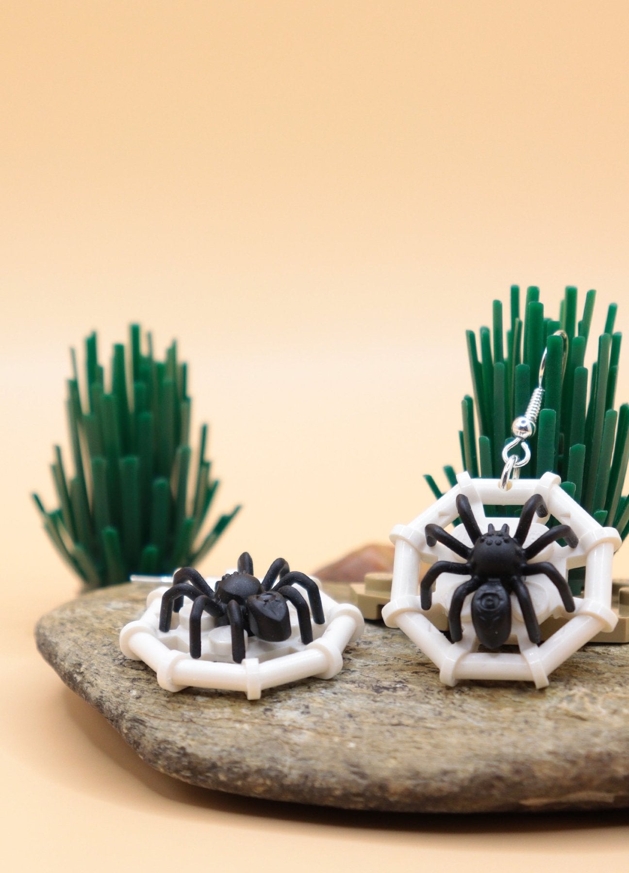 Black and white LEGO spider earrings-Spider on web – spooky Halloween novelty earrings on rock