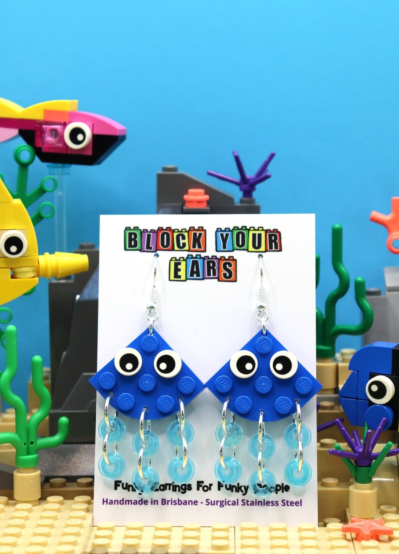 Quirky blue LEGO earrings-Jellyfish with transparent blue tentacles and cartoon eyes - display card -summer scene