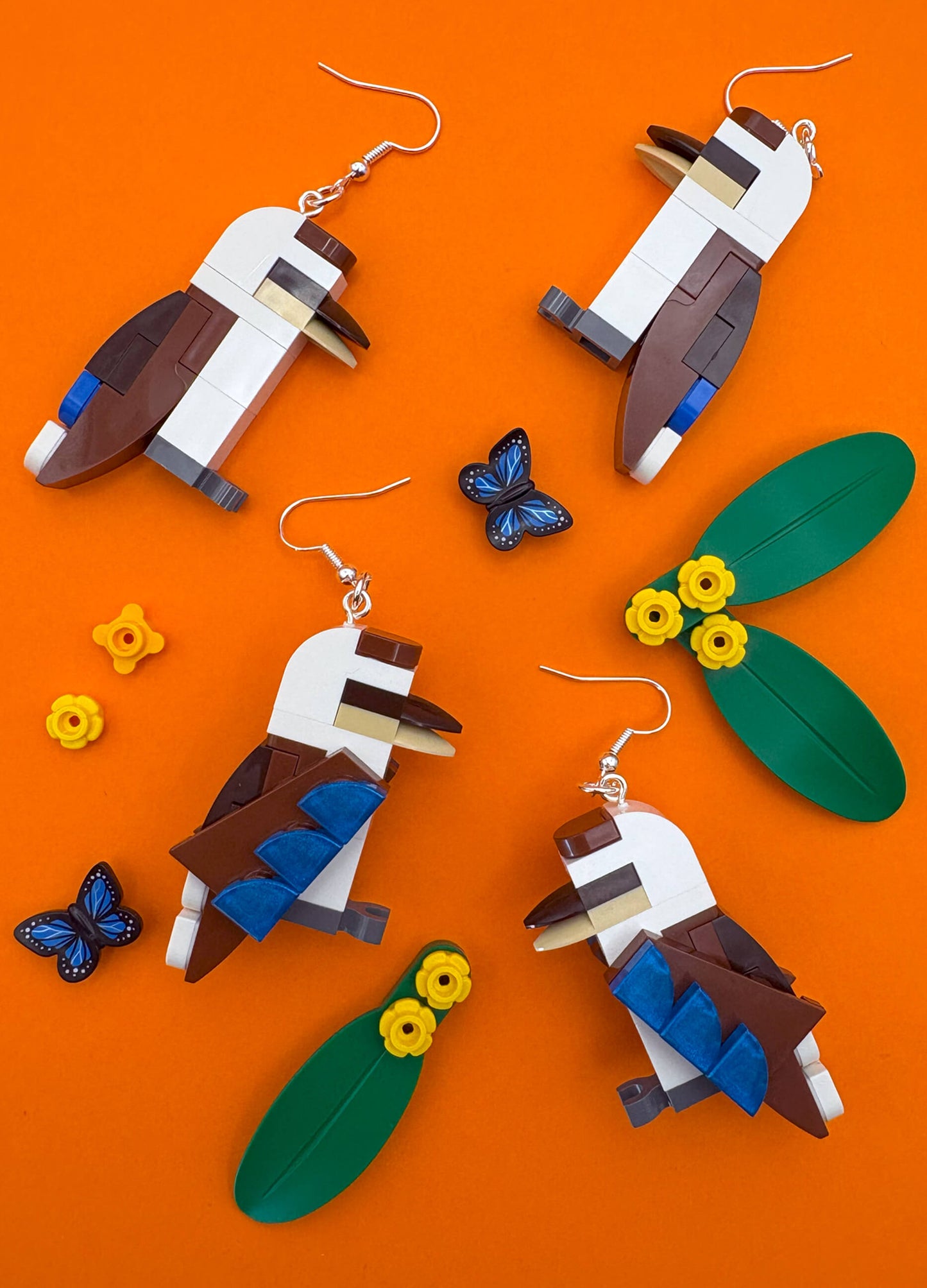 kookaburras-native-australian-birds-lego-earrings-laying-flat-orange-background.jpg