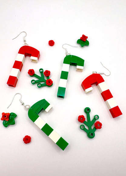 Close-up of Merry Mintmas LEGO earrings laying flat showing candy cane details