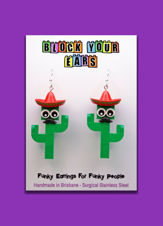Moustachioed Amigos green LEGO cactus earrings, red sombreros, cartoon eyes, and black moustaches – fun novelty earrings