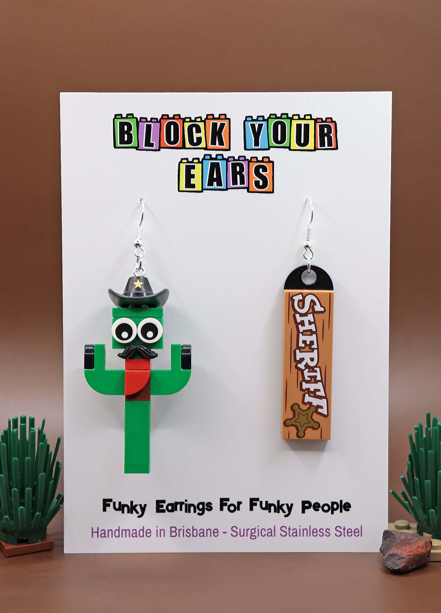 Funky LEGO cactus earring with moustache and sheriff hat - Green-Red -  Brown background