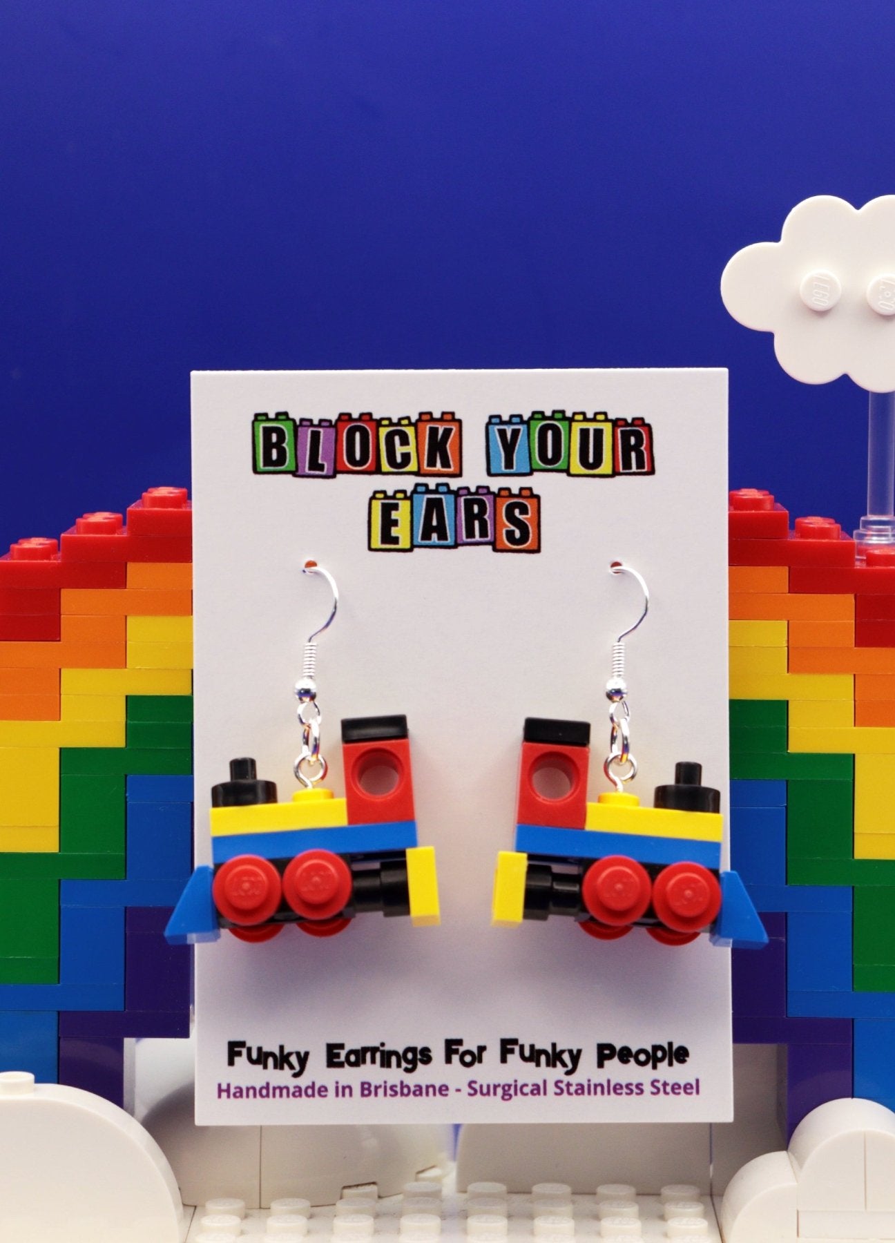 Miniature train earrings made from LEGO-Cute novelty earrings -Yellow/Blue/Red - On display card -Rainbow brick background