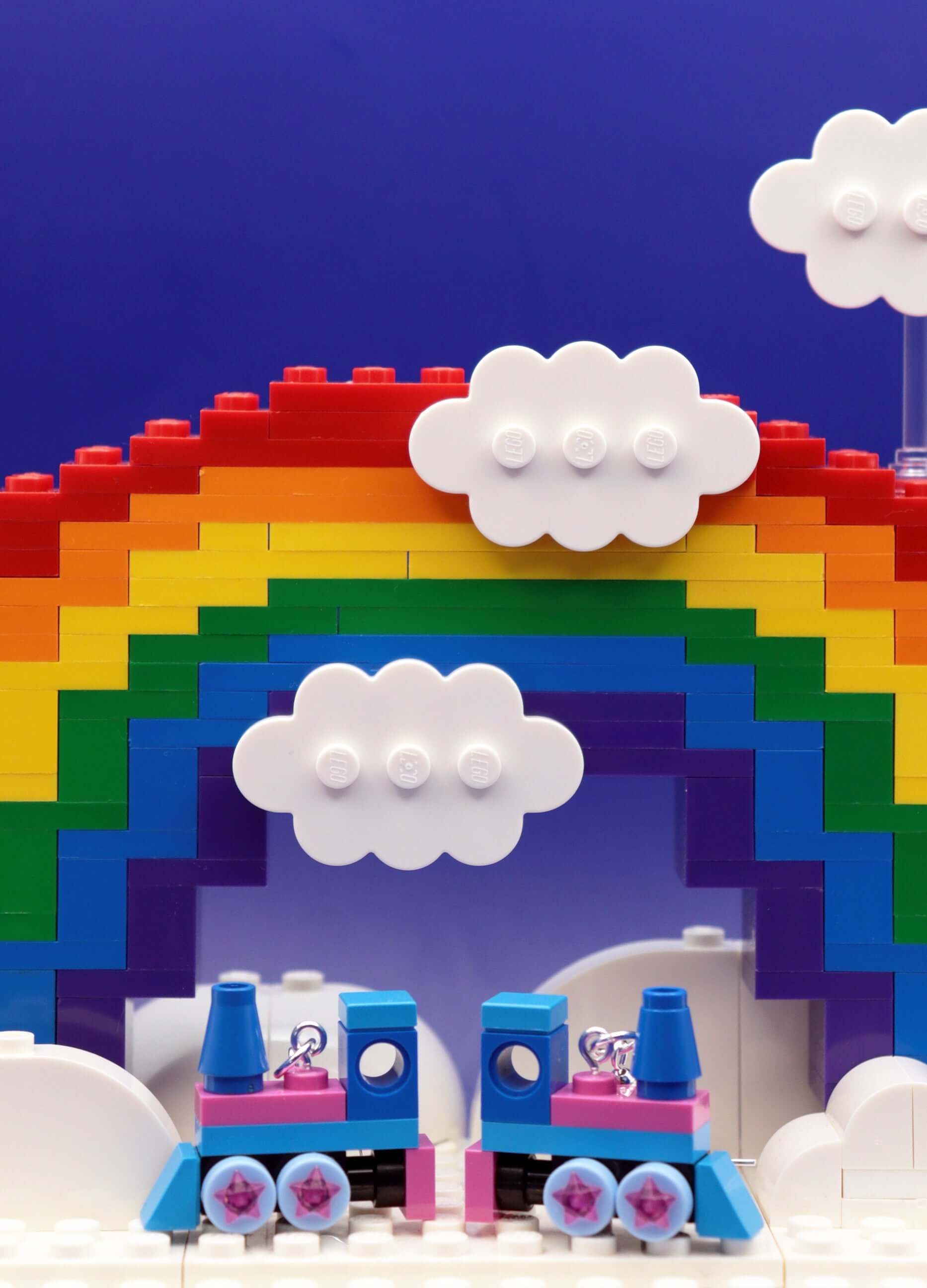 The Starlight Express- quirky earrings – pink and blue LEGO earrings-close up of miniature train on rainbow